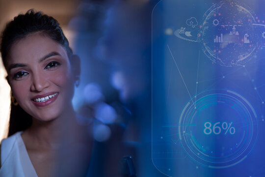 Businesswoman Smiling with icons on virtual screen