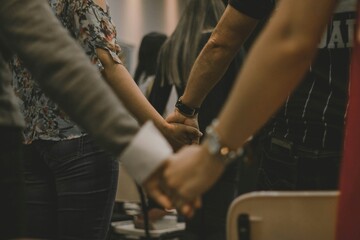 Supportive group of people holding hands together in unity and harmony © Nazar