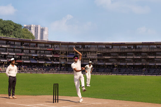 Spin Bowler about to deliver a  ball from the crease, during a cricket match