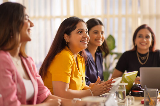 Group of businesswomen having a business meeting in office conference room