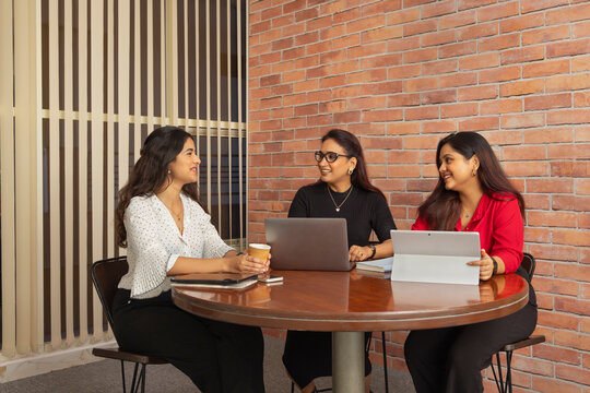 Group of businesswomen having a business meeting in office conference room