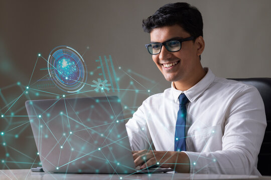 Businessman working on laptop computer with icons on virtual screen