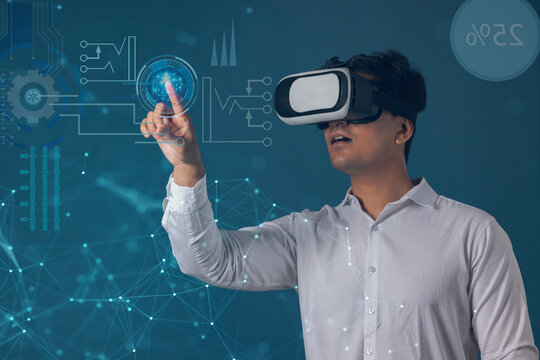  Man wearing VR headset and pointing at digital Screen 