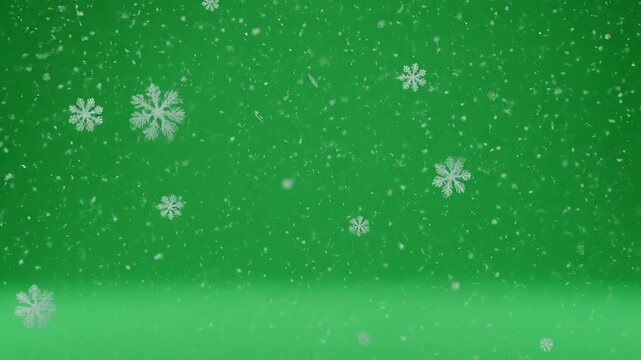 White snowflakes falling gently against a vibrant green background