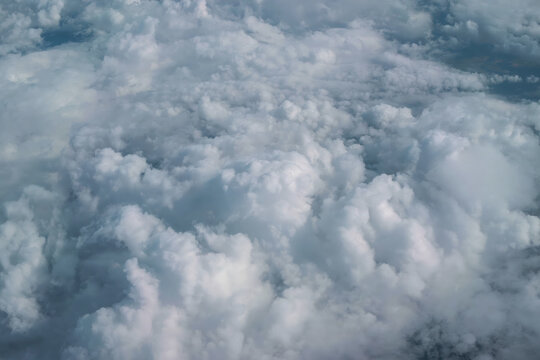 Billowy clouds above the farmland view