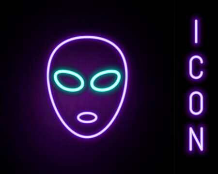 Glowing neon line Alien icon isolated on black background. Extraterrestrial alien face or head symbol. Colorful outline concept. Vector