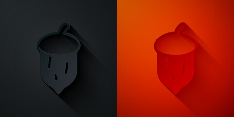 Paper cut Acorn, oak nut, seed icon isolated on black and red background. Paper art style. Vector © vector_v