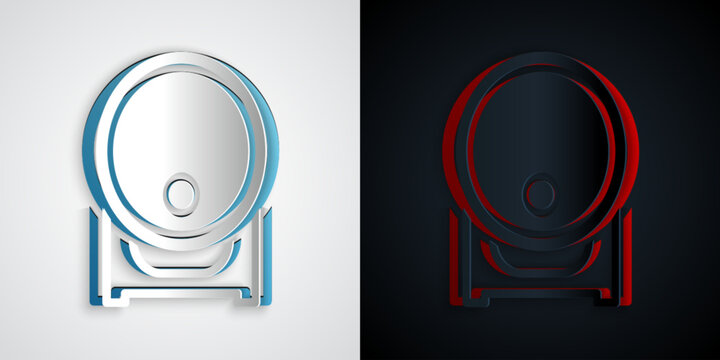 Paper cut Wooden barrel on rack with stopcock icon isolated on grey and black background. Paper art style. Vector