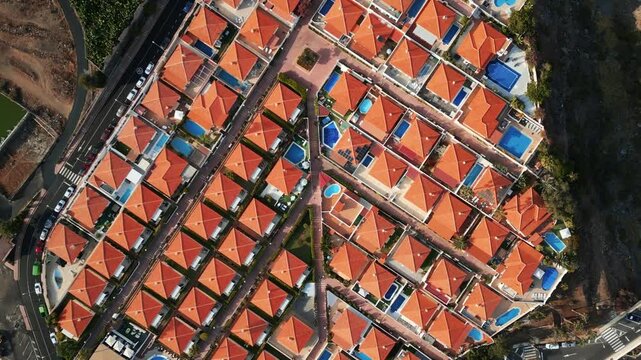 luxury villa district on Tenerife, houses and homes with orange tile, aerial drone view 4k