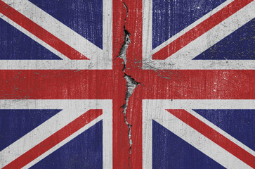 Fototapeta premium British Union Jack flag are painted on an old wall with a cracked