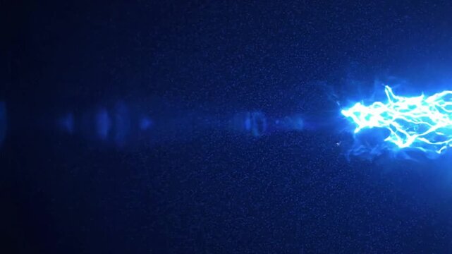 Blue light moves and flashes against a dark blue background in smooth patterns during late evening