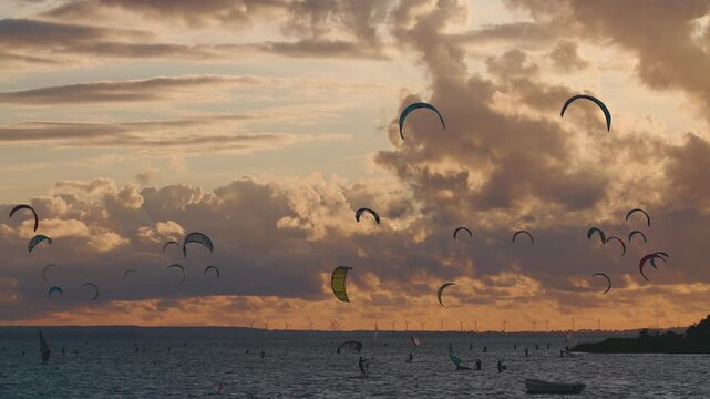 professional kite surfing on ocean or sea sunset, kitesurfing training at water 4k