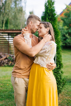Pregnant Woman With Partner Sharing Romantic Moment