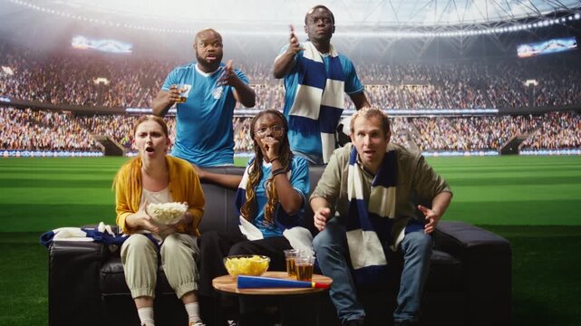 Jolly soccer fans cheer on the couch after a goal, feeling inside the stadium as ecstatic football supporters enjoy immersive match day at home.