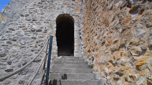 Walking up stone stairs into the old town in Ulcinj, Montenegro