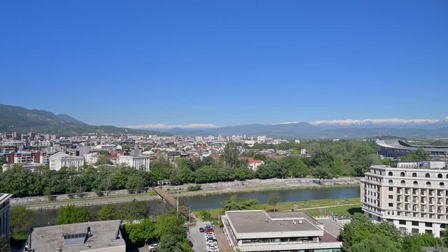 Skopje cityscape with the Vardar river and mountains