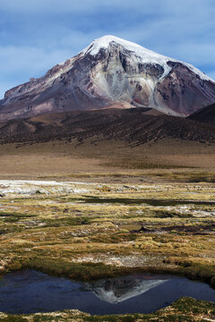 Snowcapped volcano Sajama with mirror reflection, Sajama National Park, Bolivia