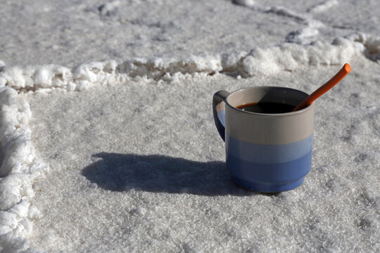 cup of coffee in salar ground, Coipasa, Bolivia