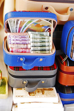 Bolivia, Copacabana, close-up of bundled paper notes inside an open container stacked on other closed container, displayed for sale