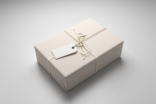 White gift box mockup wrapped in cream paper with white string, blank hang tag template on cardboard parcel package isolated on gray background, perspective present box layout, 3d render