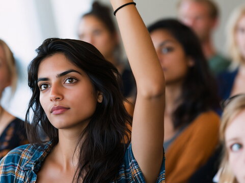 Eager Student Raising Hand to Contribute Insights in Bright Classroom, Radiating Enthusiasm and Engagement During Interactive Learning Session