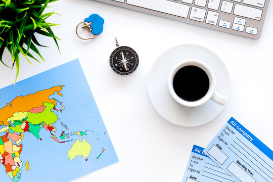 planing trip with tickets, keyboard and map on white background top view