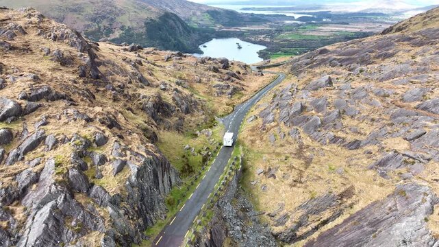 Campervan on mountain road defending into Co.Kerry from the Healey pass summer evening on The Wild Atlantic Way Ireland Epic Locations