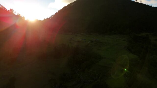 Aerial drone footage over a lush green valley in Sillar de los Indios, Constanza, Dominican Republic