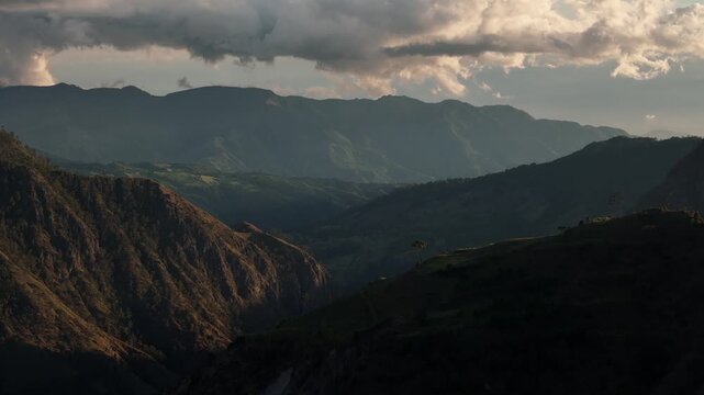 Aerial drone footage over a lush green valley in Sillar de los Indios, Constanza, Dominican Republic