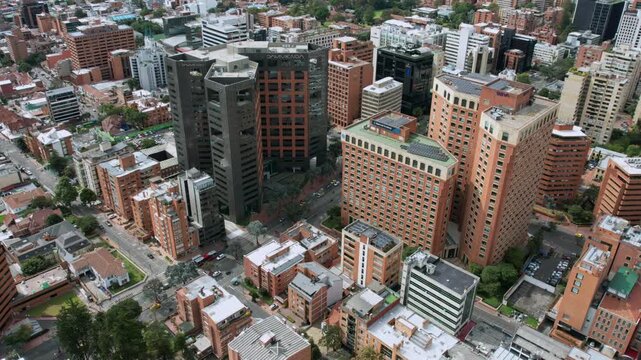 Hyperlapse orbit counterclockwise of the Bogota cityscape with high-rise towers and surrounding neighborhoods.