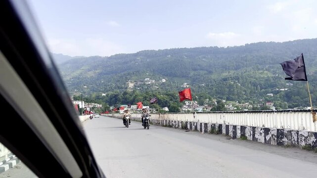 Muharram Flags Displayed on River Bridge Symbolizing Religious Commemoration, Islamic Tradition, Community Unity and Cultural Heritage During Muharram Procession