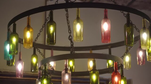 Unique light fixture made of colored bottles in a restaurant