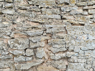 Fototapeta premium Urban wall texture shows rough stones and natural patterns for design ideas and background use in various projects and artworks