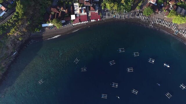 Drone Orbiting High Above Amed Bay Jukung Boats Bali Indonesia.