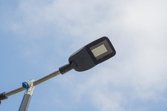 Corby, Northamptonshire, United Kingdom - July 15, 2026: Modern LED street light against blue sky with copy space
