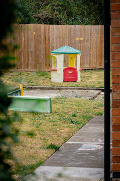 Corby, Northamptonshire, United Kingdom - July 15, 2026: Children's playhouse in quiet residential backyard garden