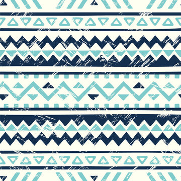 Navajo inspired geometric pattern with tribal motifs in navy blue and aqua on cream