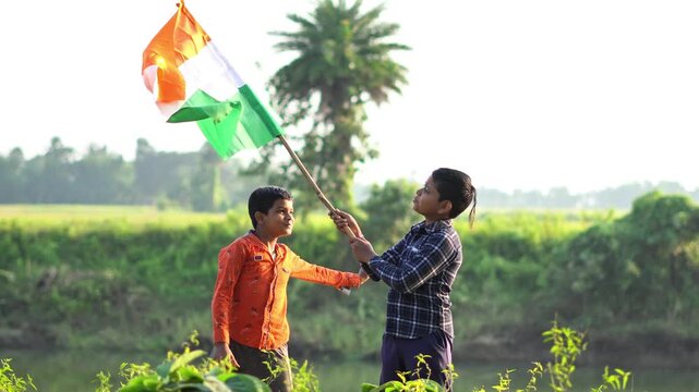Republic Day India Celebration with Rural Kids and Big Waving Tiranga. Indian Independence Day in Countryside. India Flag Near River Bank with Two Young Patriotic Friends.