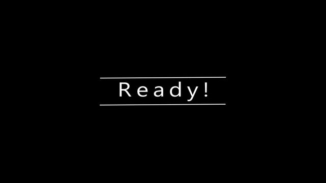 Simple white text on a black background displaying the word Ready underlined by two thin horizontal lines, conveying a sense of preparedness and initiation for a task or event, with a clean and
