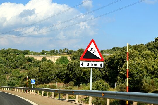 A road warning sign indicating a 5% gradient for 3 kilometers, located along the A-6 motorway in Spain. June 29, 2026