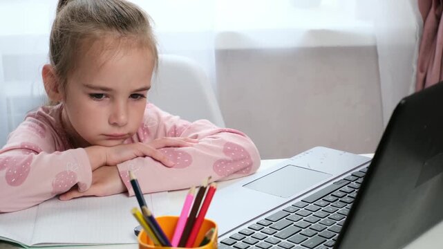 Frustrated child doing homework at home, learning difficulties
