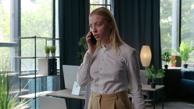 Irritated stressed Caucasian business woman arguing phone throwing papers away mad with work job bad result businesswoman female girl entrepreneur argue talking mobile call throw documents in office