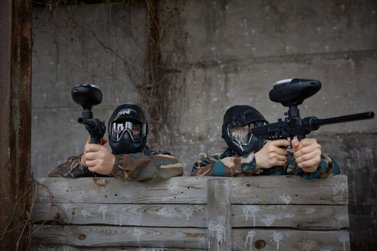 Two soldiers take defensive positions during tactical weapon training