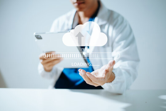 Doctor using tablet to upload medical data to secure cloud storage. Modern healthcare technology, telemedicine, digital health, cybersecurity and cloud computing.