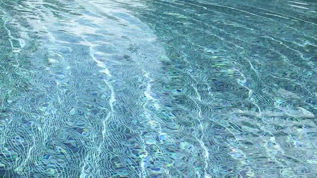 Swimming pool with blue crystal clear water surface and ripple wave background