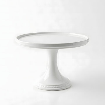 Empty white ceramic cake stand with a smooth glossy finish sitting on a bright surface