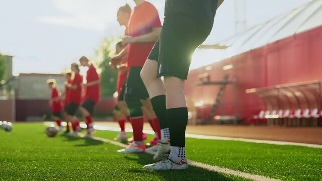 Focused womens soccer training session with players practicing coordinated footwork, ball control drills, and teamwork on a sunny outdoor artificial turf field