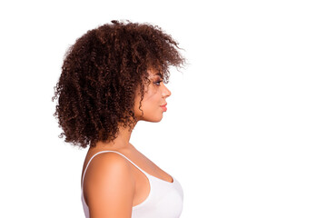 Side view, profile portrait with cope space, empty place of charming, sexy, pretty, attractive, nice girl with modern hairstyle, isolated on grey background, having plump, pout lips © deagreez