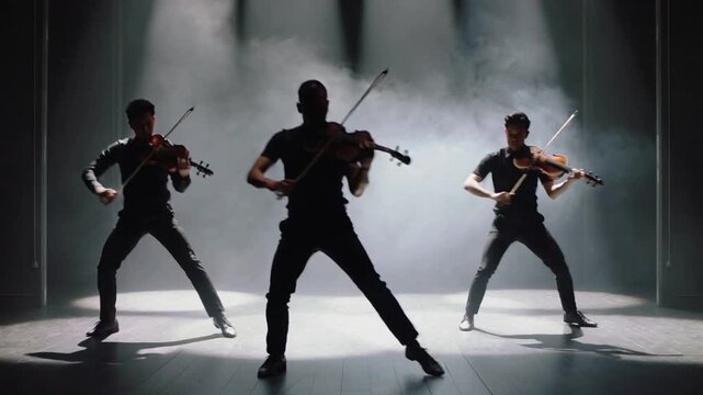 Lighting central trio playing on dim stage bowing violins, stepping, wearing dark clothes for stage