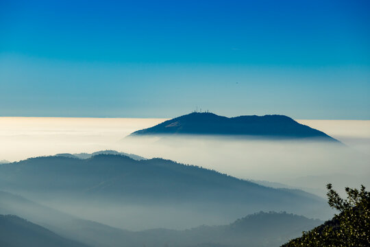 View of mountains and clouds from Sequoia National Park towards Central Valley near Visalia in California